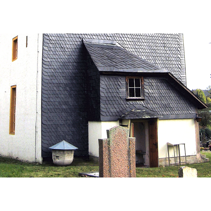 outside, at the west end; the present cover has obviously been installed to protect the stone from the elements