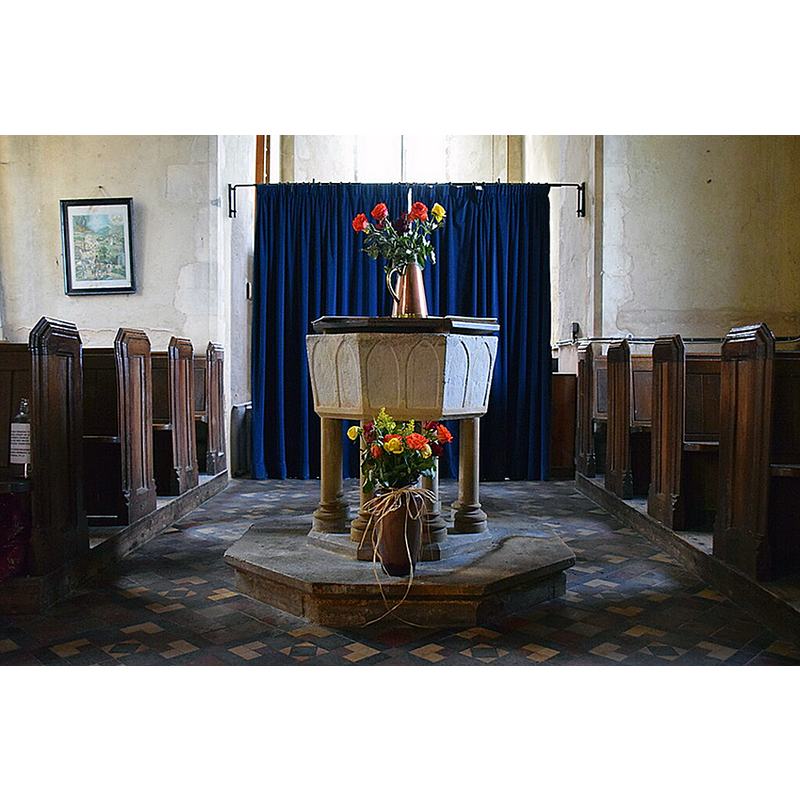 Source caption: "There is one of those 13th century Purbeck marble fonts more familar from the east of Suffolk, supported here on pretty Victorian pillars."
