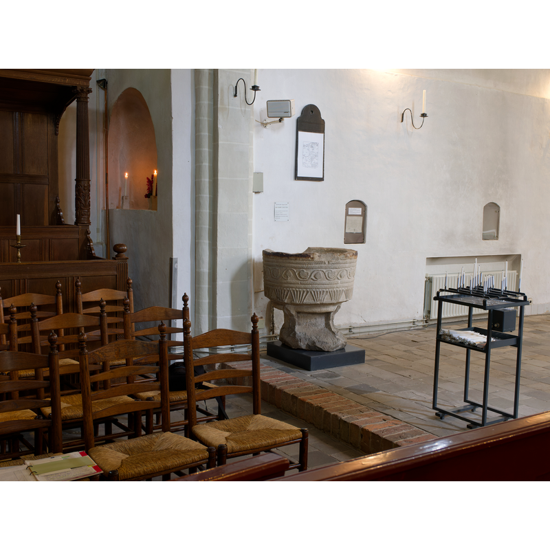 the Bentheim sandstone font is located inside the chancel, by the side of the north pillar of the arch