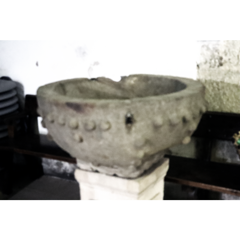the damage to the upper rim at the back, and the metal staple on the opposite front side were the anchoring spots for the missing font cover