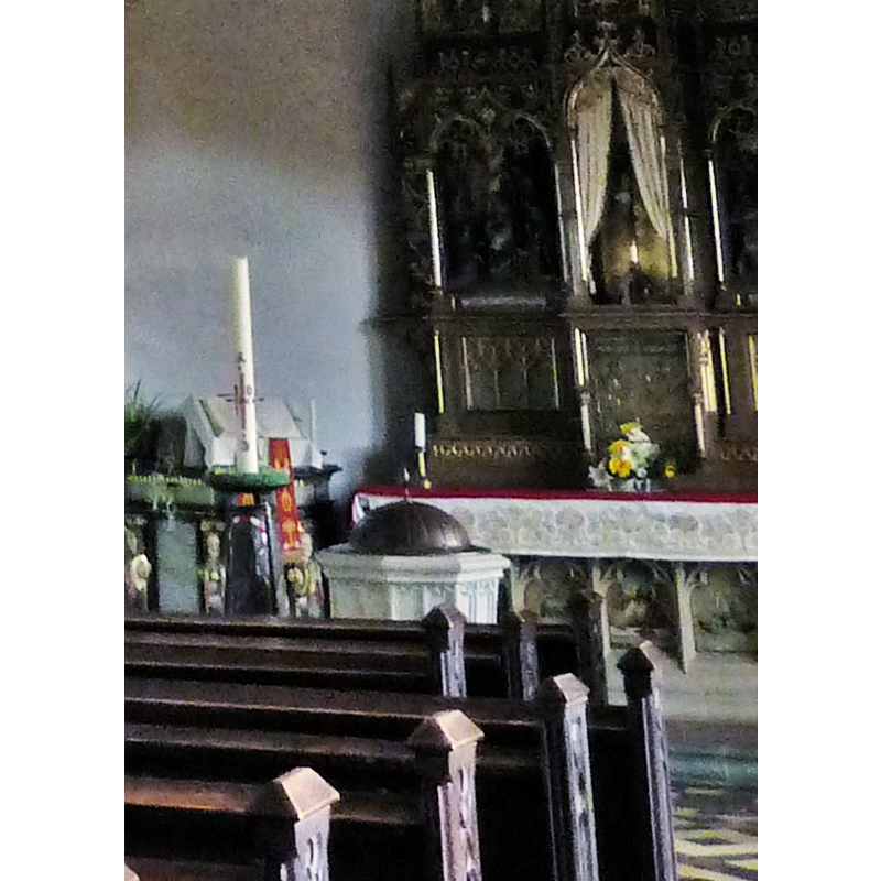 partial view of the font and its cover at the east end of the north aisle