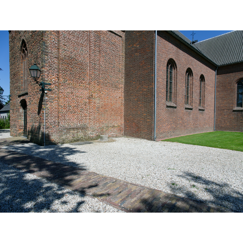 the base of the medieval font here, according to one source [cf. FontNotes]: Outside the church is the base and column of the font, and these were used as "roepsteen" or "pierre de criée" for public announcements.