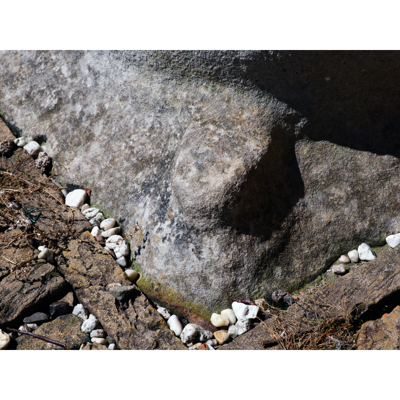 the damage above the foot would probably have been the location of one of four figures or animals
