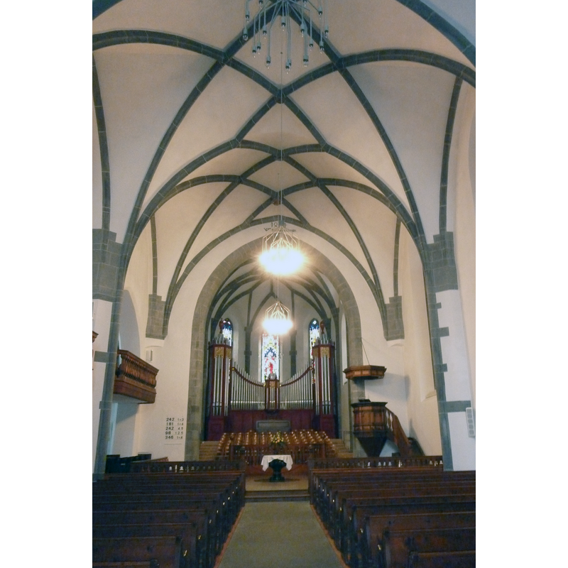 Source caption: "St. Martin Chur innen" -- showing the chancel with mid-17thC black-granite baptismal font in the centre of the image