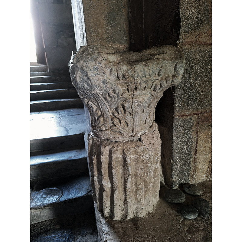 One of two former Romanesque capitals re-purposed as holy-water stoups and located by the entranceway