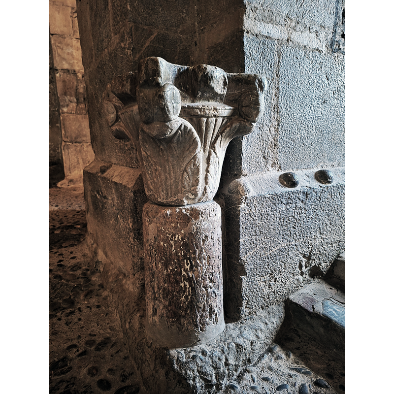 One of two former Romanesque capitals re-purposed as holy-water stoups and located by the entranceway