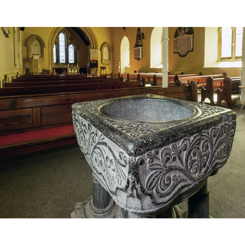 Source caption: "Medieval Romanesque Baptismal Font at St. Davids Naas. The font dates to the 11c and was found abandoned in the church grounds in 1860 when it was brought back into the church to its present location."