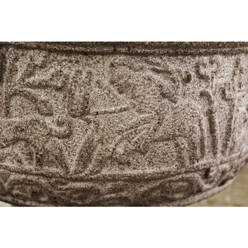 partial scene: a reindeer (?) stands looking left to the right of the tree in the previous scene but appears to be the prey of a mounted hunter and his large mastif coming from the right [cf, FontNotes]
