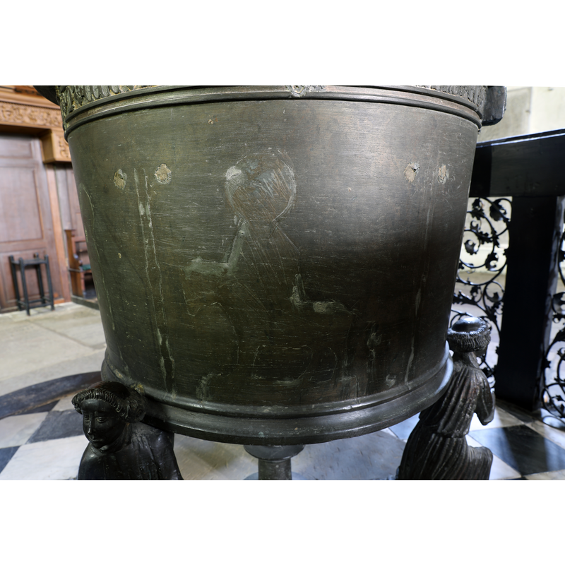 showing the traces of the figural decorations removed