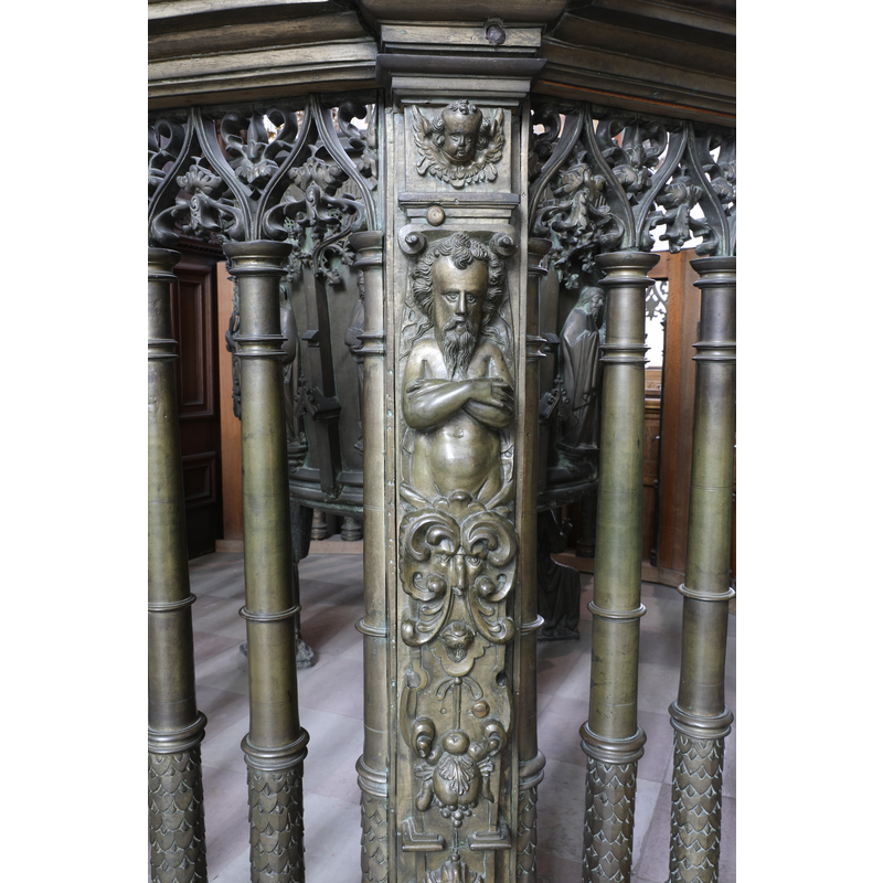 part of the railing that encloses the baptismal font