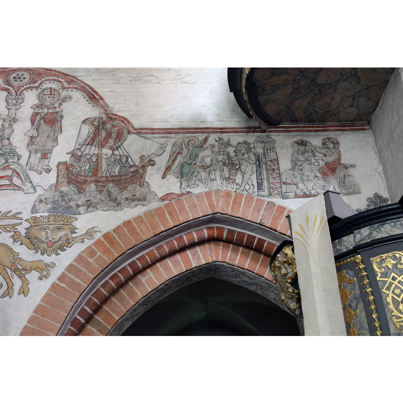 the restored late-medieval mural paintings on the north wall