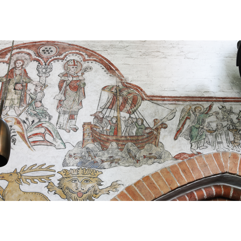the restored late-medieval mural paintings on the north wall