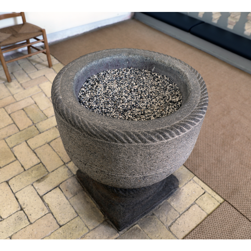 showing the inside of the basin filled with gravel