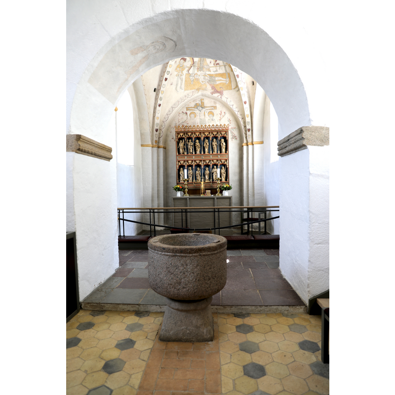 showing the font in the foreground, just west of the chancel arch