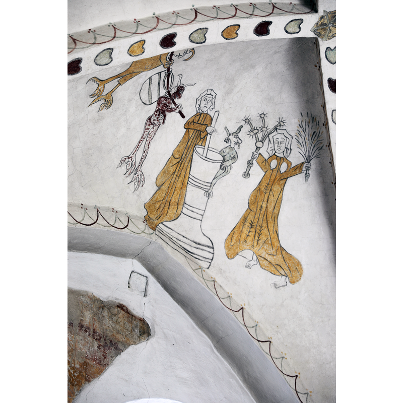 the Devild and the butter-churcning milk-maids depicted on the apse