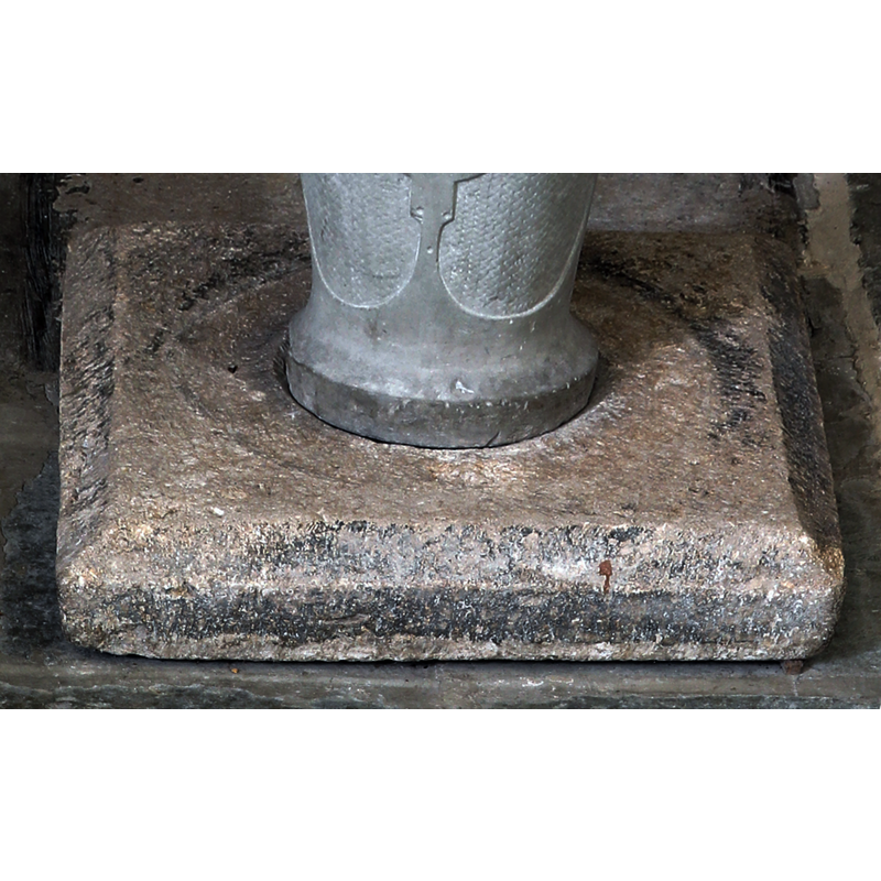 showing the square 12thC(?) stone serving as plinth beneath the later font