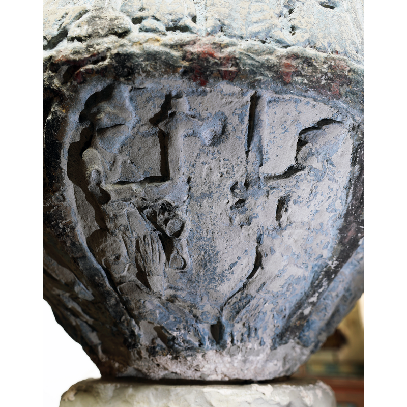 beneath one of the Passion scenes; two standing figures facing each other; the one on the left holds up a cross; the facing figure on the right wields a sword; in the bottom left corner is a seated or semi-lying figure with hands together in prayer [NB: the reading of this scene depends on whether one accepts that the object held up by the standing figure on the left is a cross or a battle ax; we interpret it as being a cross]