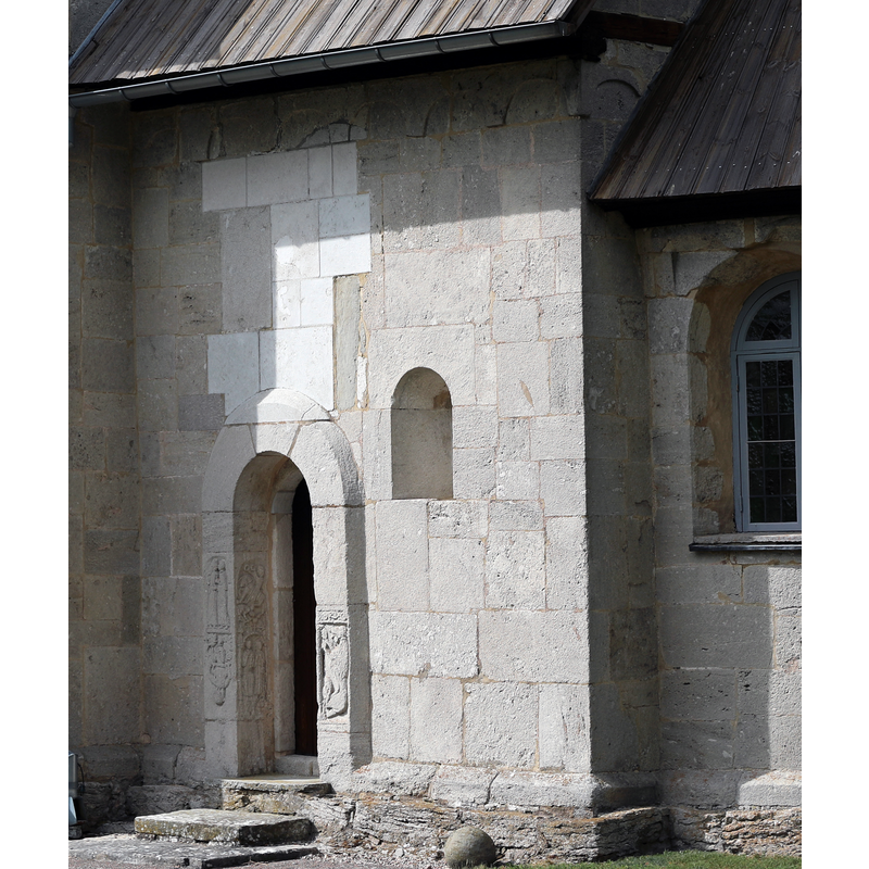 showing the southeast or priest's portal with medieval carvings
