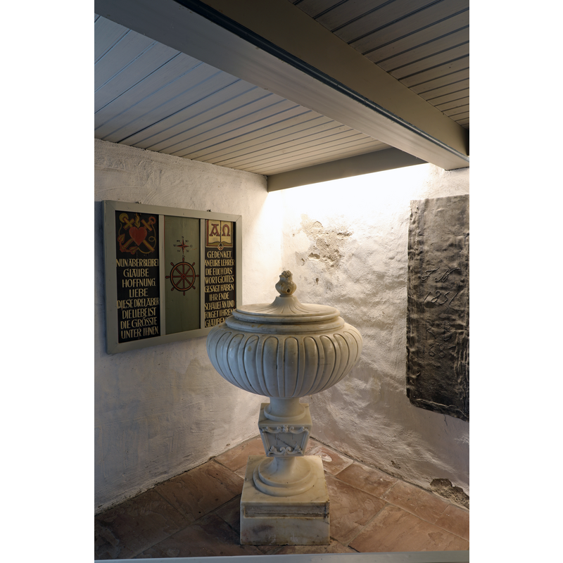 the 1752 marble font in the vestibule