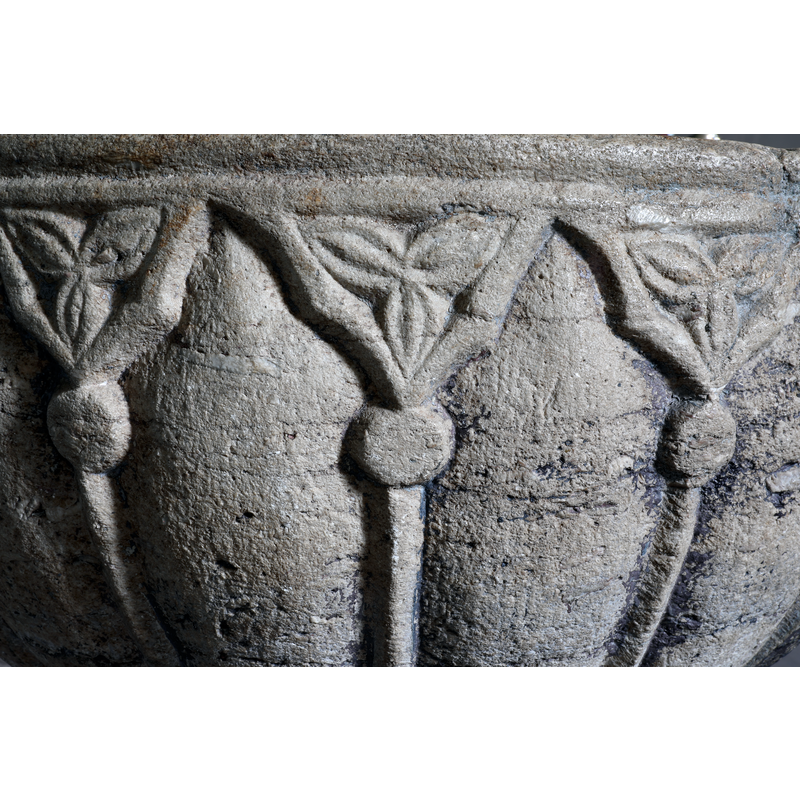 one in each of the spandrels of the arcade
