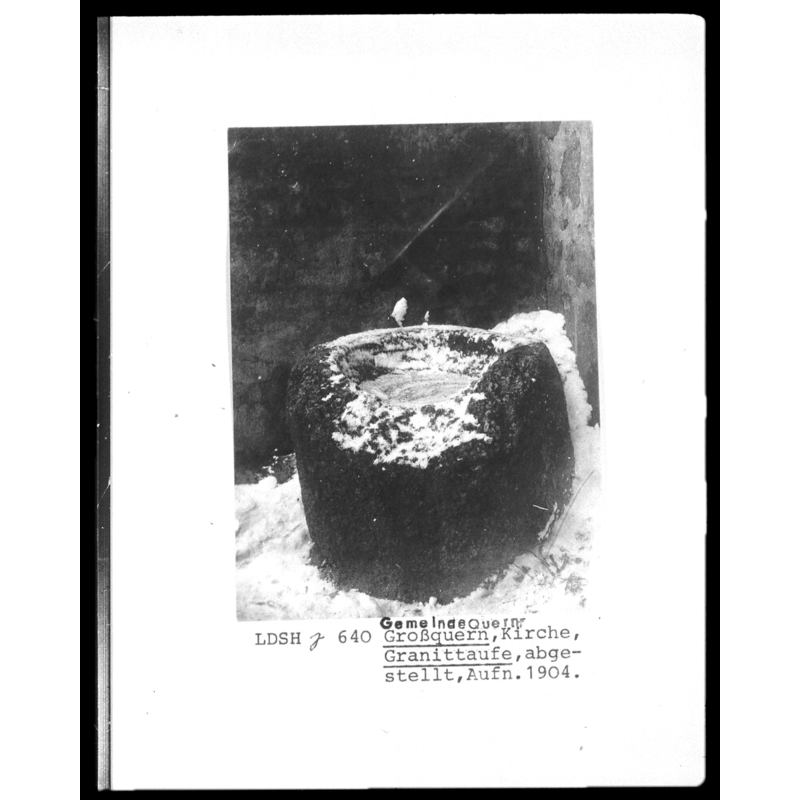 A possible former font or stoup? -- Source caption: "Kværn kirke i Sydslesvig-tidligere granitdøbefont eller granitvievandskar uden for kirken."
