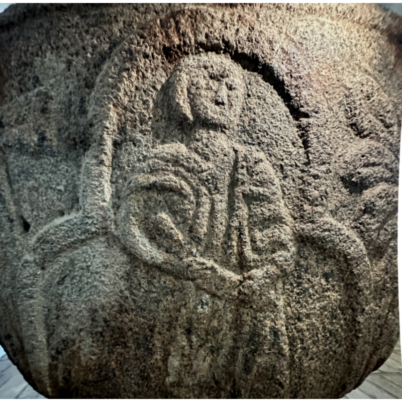 if the opinion that the four Evangekists' symbols are represented on the basin this would have to be Matthew's angel, despite the apearances