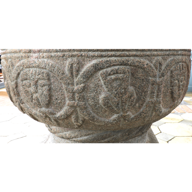 showing three of the heads, faces or masks
