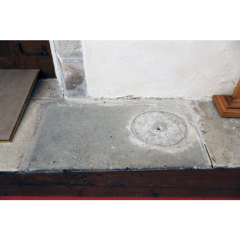 the shape and location it was an earlier plinth for the font