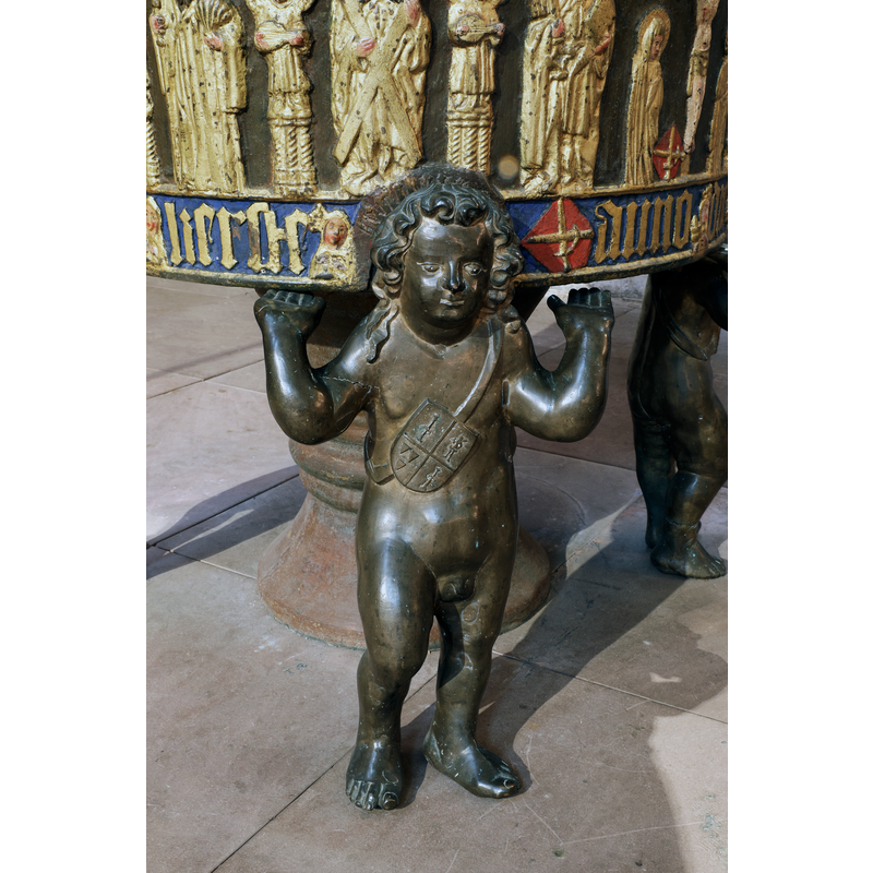some of them supported by standing figures of angels