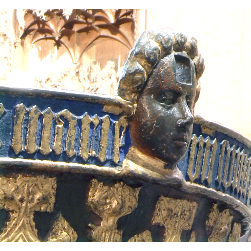 one of two set at the upper rim as parts of the locking system of the original font cover -- the square hole through which the locking bar would go is discernible hwre on the forehead