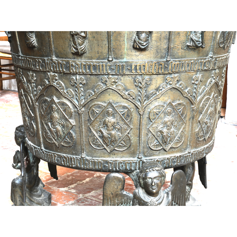 the inscription in the middle includes the date of the font, 1357, in Roman numerals
