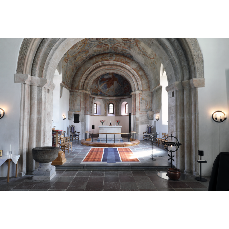 showing the old basin, on a new base, re-installed in the church