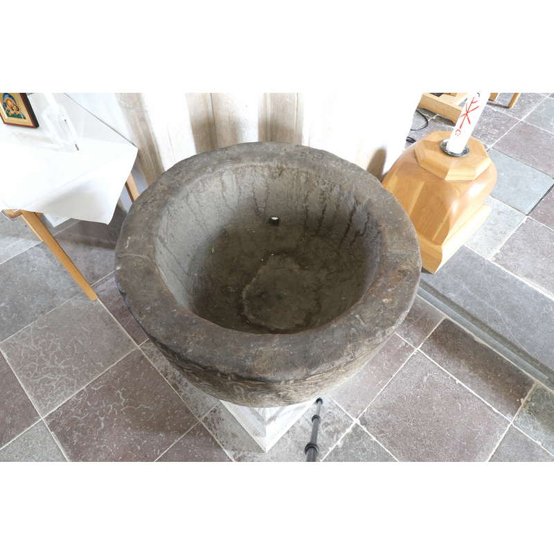 showing the old basin, on a new base, re-installed in the church