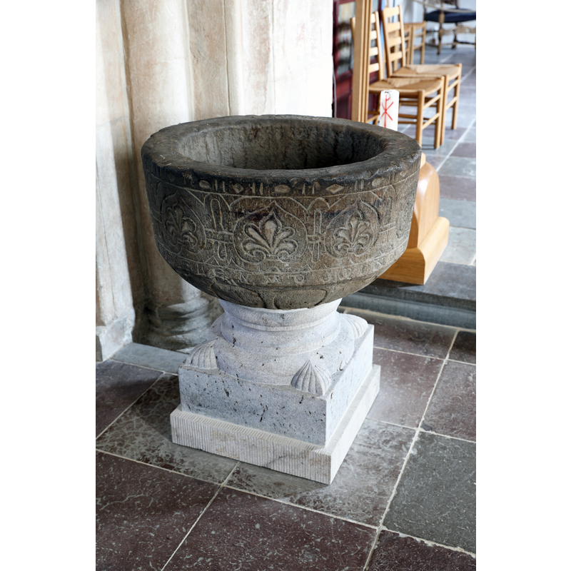 showing the old basin, on a new base, re-installed in the church