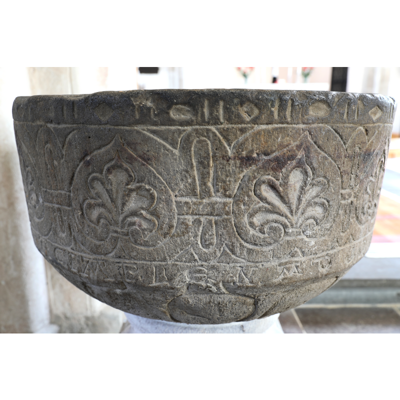 showing the old basin, on a new base, re-installed in the church
