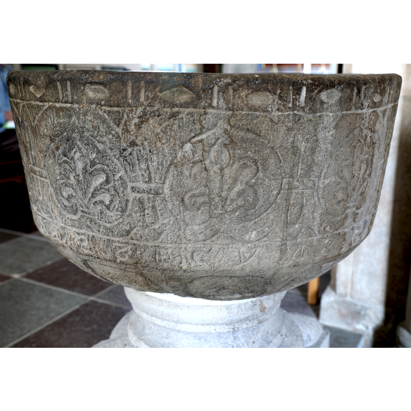 showing the old basin, on a new base, re-installed in the church