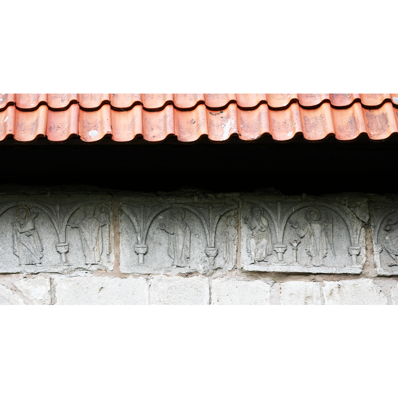carved stones originally from the Romanesque church that were incorporated into the Gothich church; they are characteristic of the Byzantios workshop of Gotland