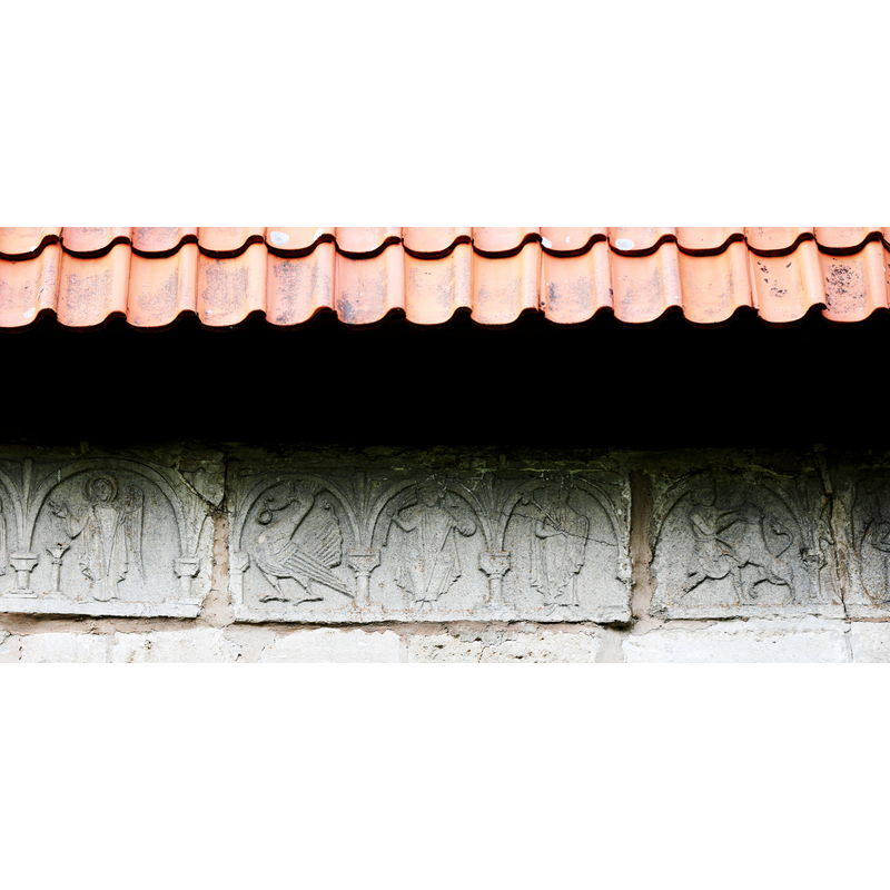 carved stones originally from the Romanesque church that were incorporated into the Gothich church; they are characteristic of the Byzantios workshop of Gotland