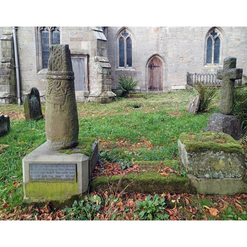 Source caption: "Anglo-Scandinavian cross shaft depicting a Viking warrior, Brailsford churchyard. Possibly a memorial to the person depicted. Early 11th century, scheduled monument. Churchyard of All Saints' Church, Brailsford, Derbyshire, England."