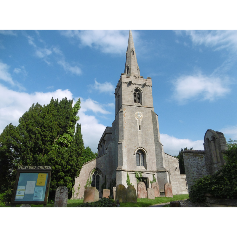 Source caption: "St Mary's Church, Wilsford is dominated by its slender Perpendicular spire. The church itself is mainly Early English, although there are two Norman piers in the nave from an earlier building.:"