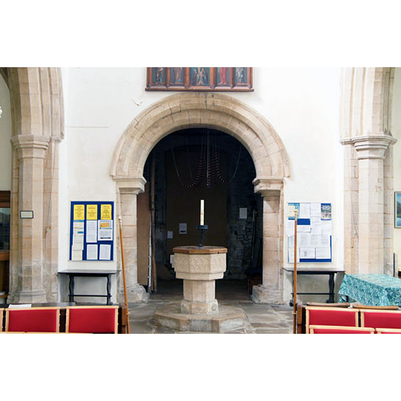 Source caption: "The tower arch is late Norman, dating from the time when the original Anglo-Saxon rubble wall was faced with dressed stone."