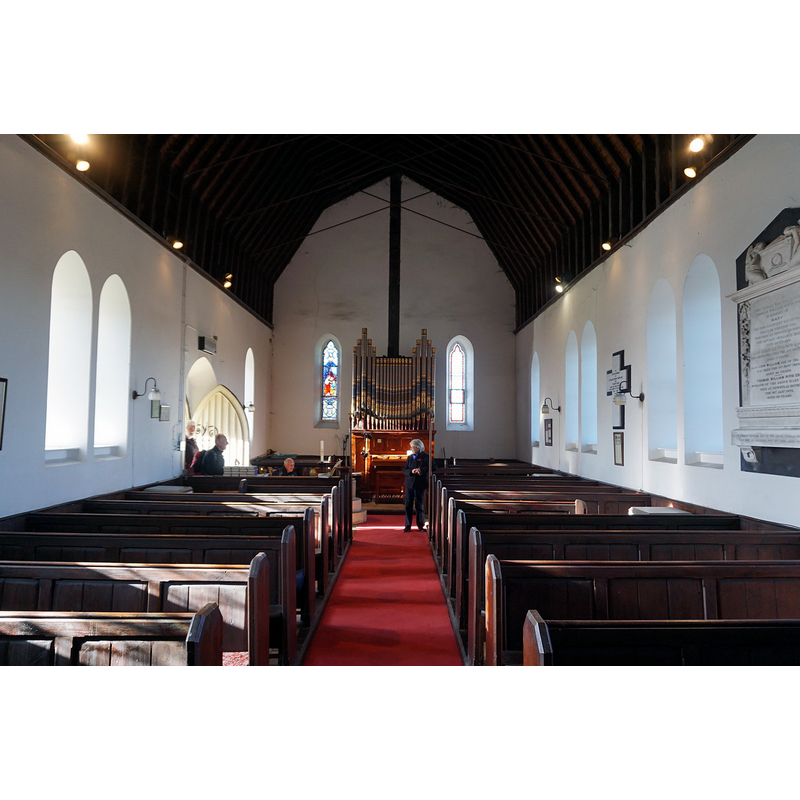 Source caption: "All Saints Church, Burythorpe" -- partially showing the font at the far [west] end, left [south] side, behind the bank of benches
