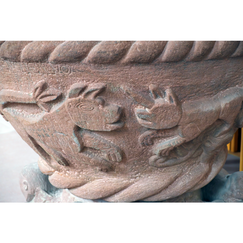 showing a partial inscription above them
