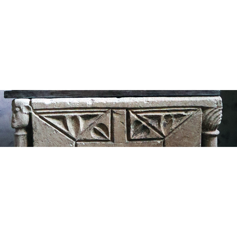 tiny eroded heads on two(?) of the upper corners of the basin, one of which is showing on the left -- the 'capital' of the right colonnette and its corresponding pair on the other side (not visible here) are patterned, foliated