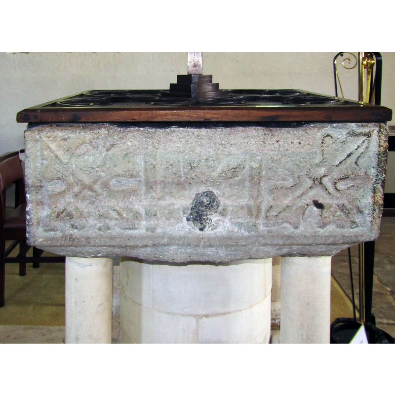 and tree? on the west side of the basin; the central panel motif is damaged by a hole now plugged with lead [cf. FontNotes]