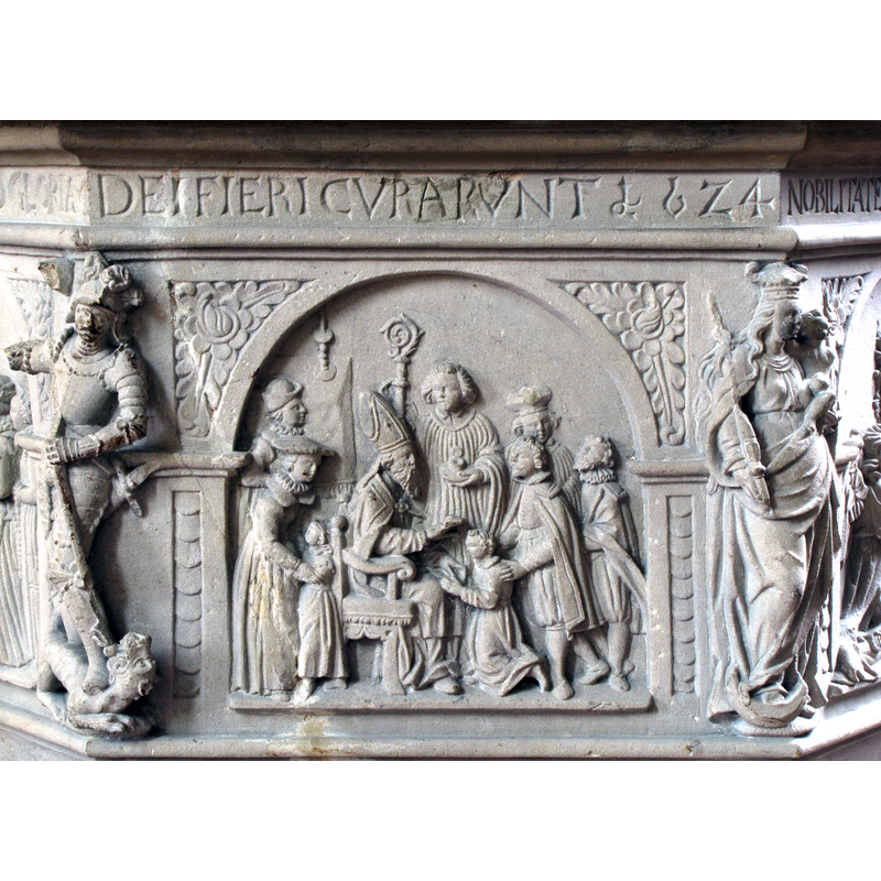 Source: "Alsace, Bas-Rhin, Église Saint-Georges de Molsheim, ancienne église des Jésuites (1618) [...] Fonts baptismaux (1624): Ordination." [erroneous identification: it shows the sacrarment of Confirmation, not Holy Orders]
