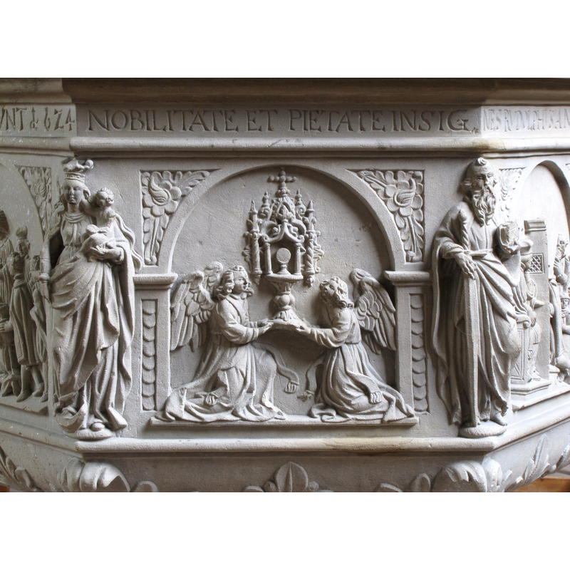Source caption: "Alsace, Bas-Rhin, Église Saint-Georges de Molsheim, ancienne église des Jésuites (1618) [...] Fonts baptismaux (1624): Eucharistie." -- showng L-->R: Madonna and Christ Child --> sacrament of the Eucharist --> St Paul