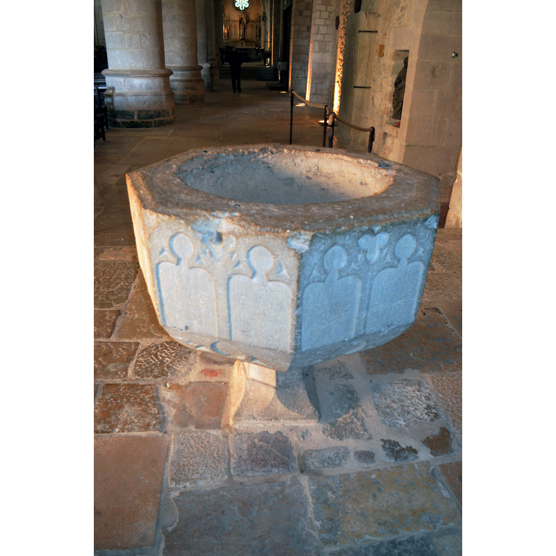 Source caption: " Interior of abbatiale Notre-Dame d'Ambronay." -- showing the damage to the upper rim area where a metal staple split the stone