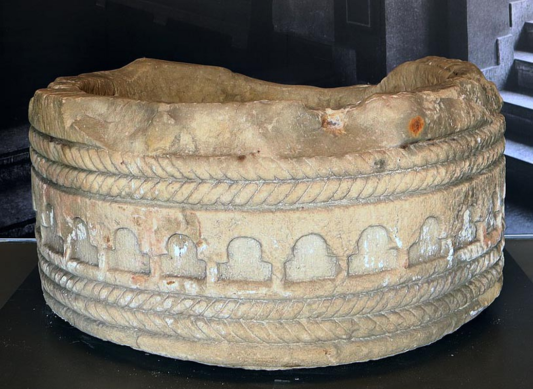 two sets, above and below the blind arcade -- the original font in the museum