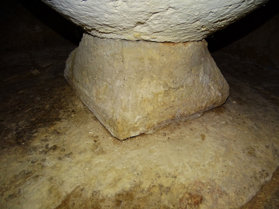 knobs or mouldings at the corners; one broken